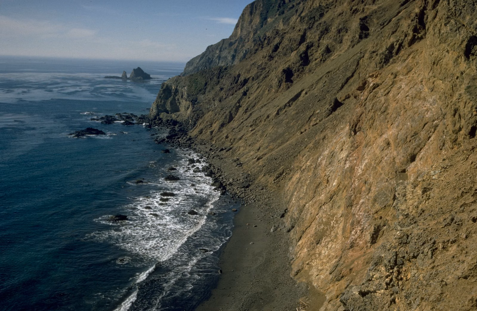 Island coastline with cliffs and rocky shore, Channel Islands
