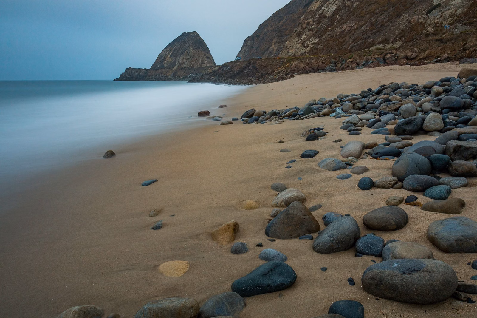 Early morning on a Southern California state beach below coastal hills